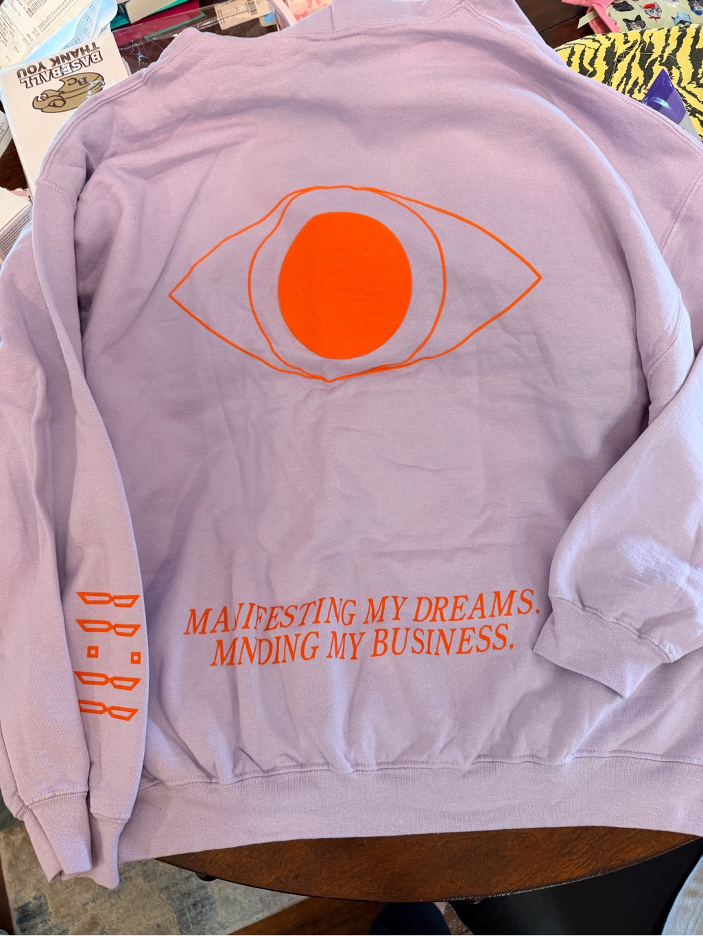 Dressed In Lala Lavender Sweatshirt With Orange Graphic